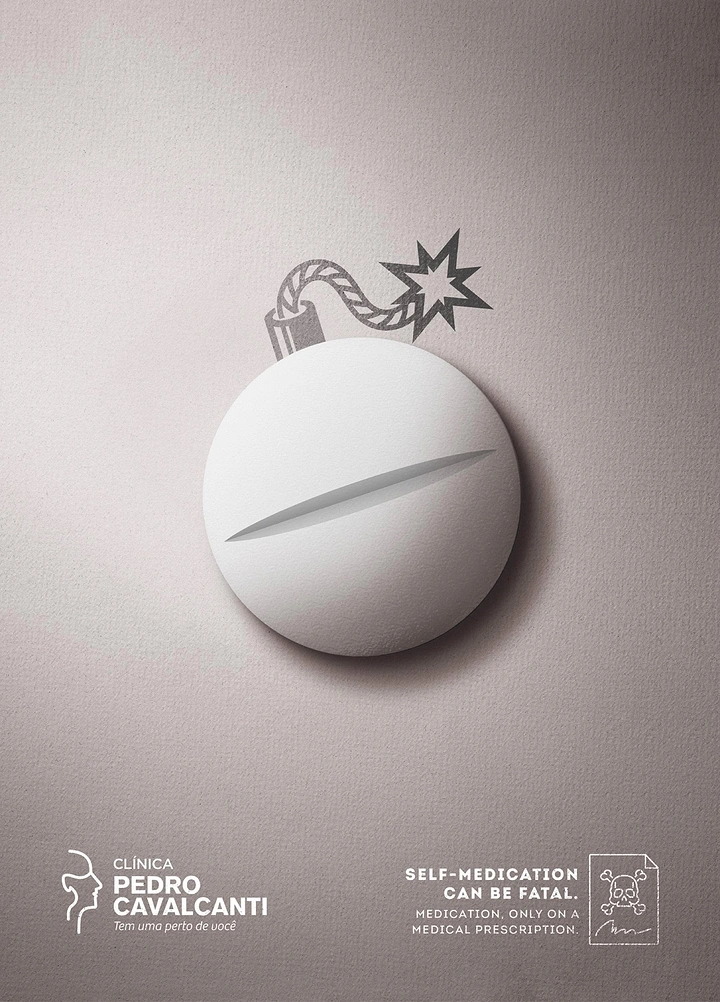 Healthcare creative ad: White tablet drawn as a bomb with a lit fuse