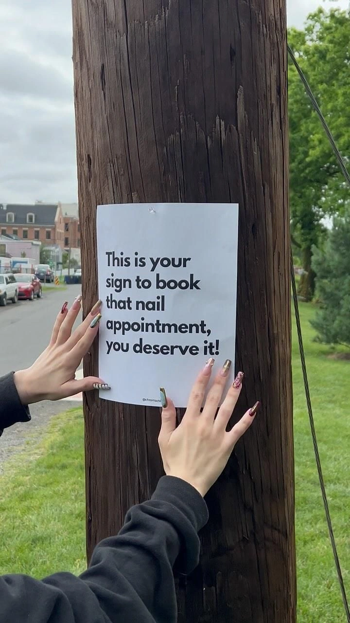 Nail Salons creative ad: Literal 'this is your sign' pole flyer pun