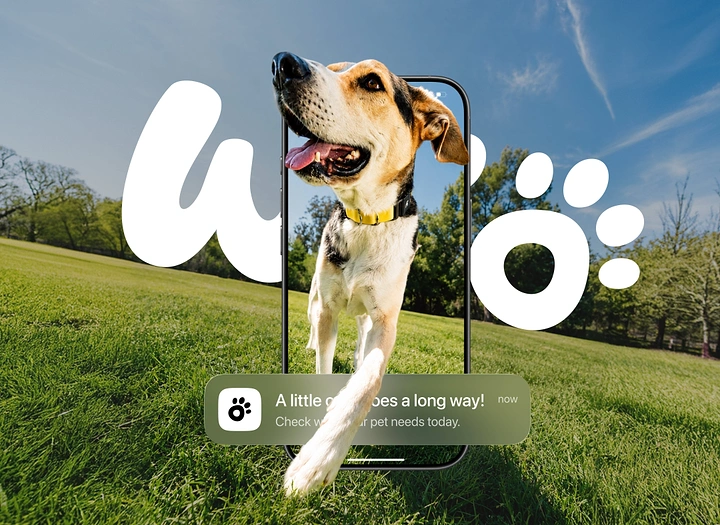 Creative ad: Happy dog stepping out of a smartphone screen onto grass