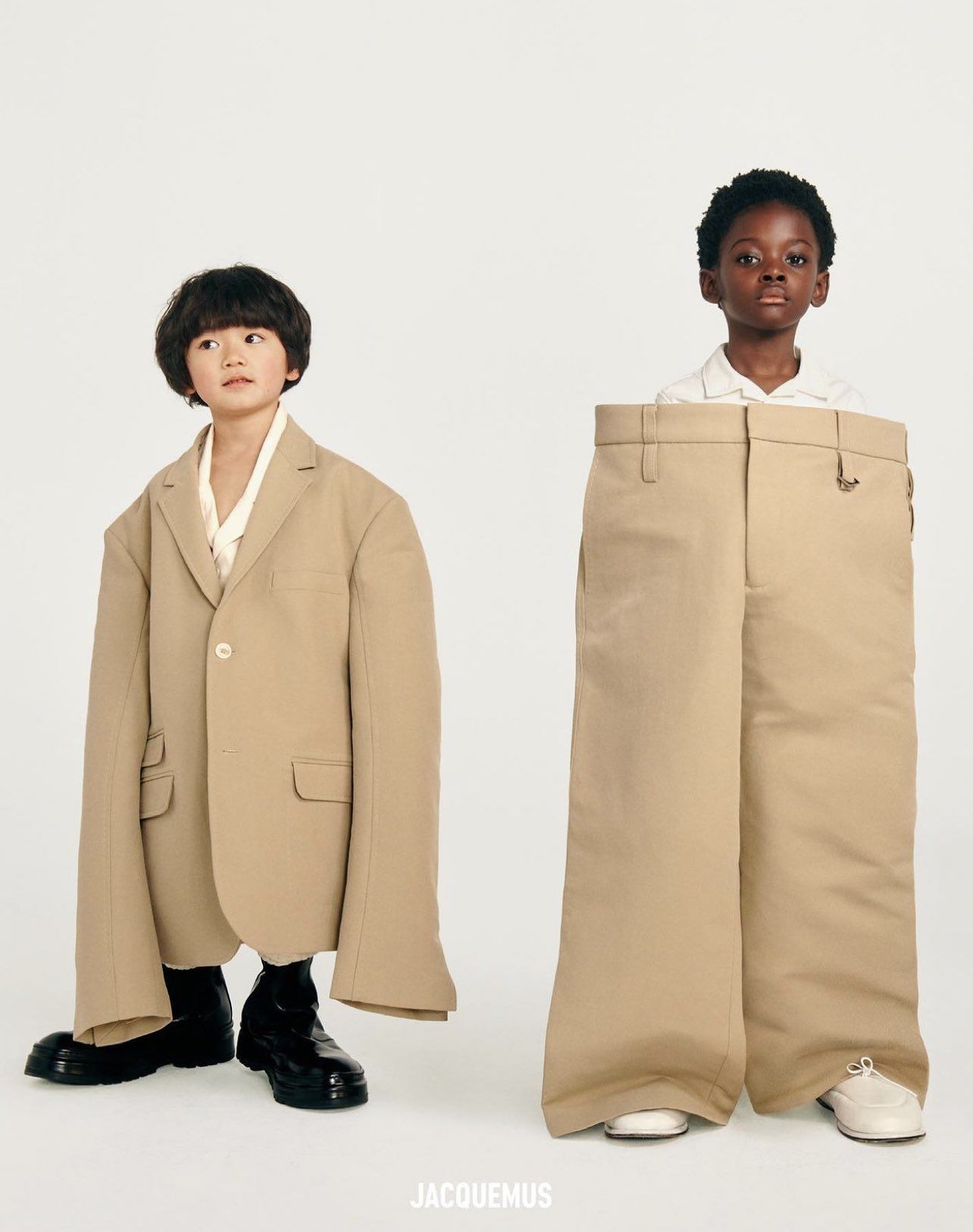 Instagram post: Two children in hugely oversized beige blazer and trousers