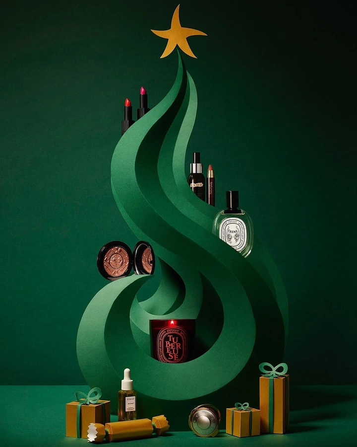 Skincare & Cosmetics creative ad: Swirling green paper Christmas tree displaying beauty products
