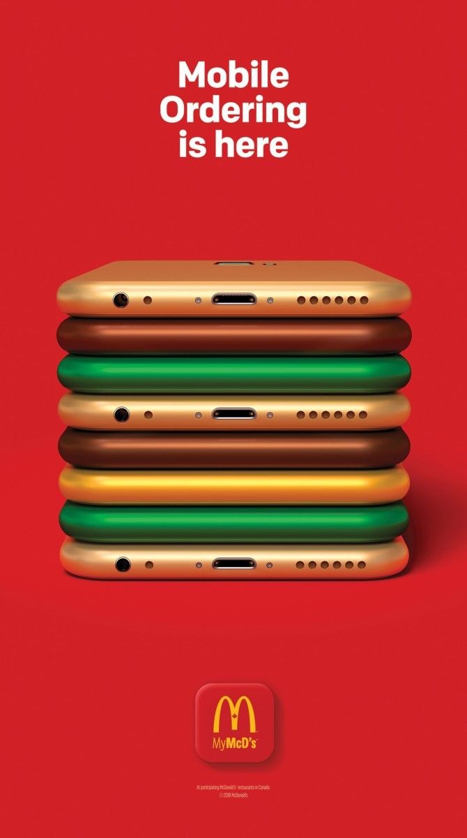 Stack of coloured smartphones forming a burger