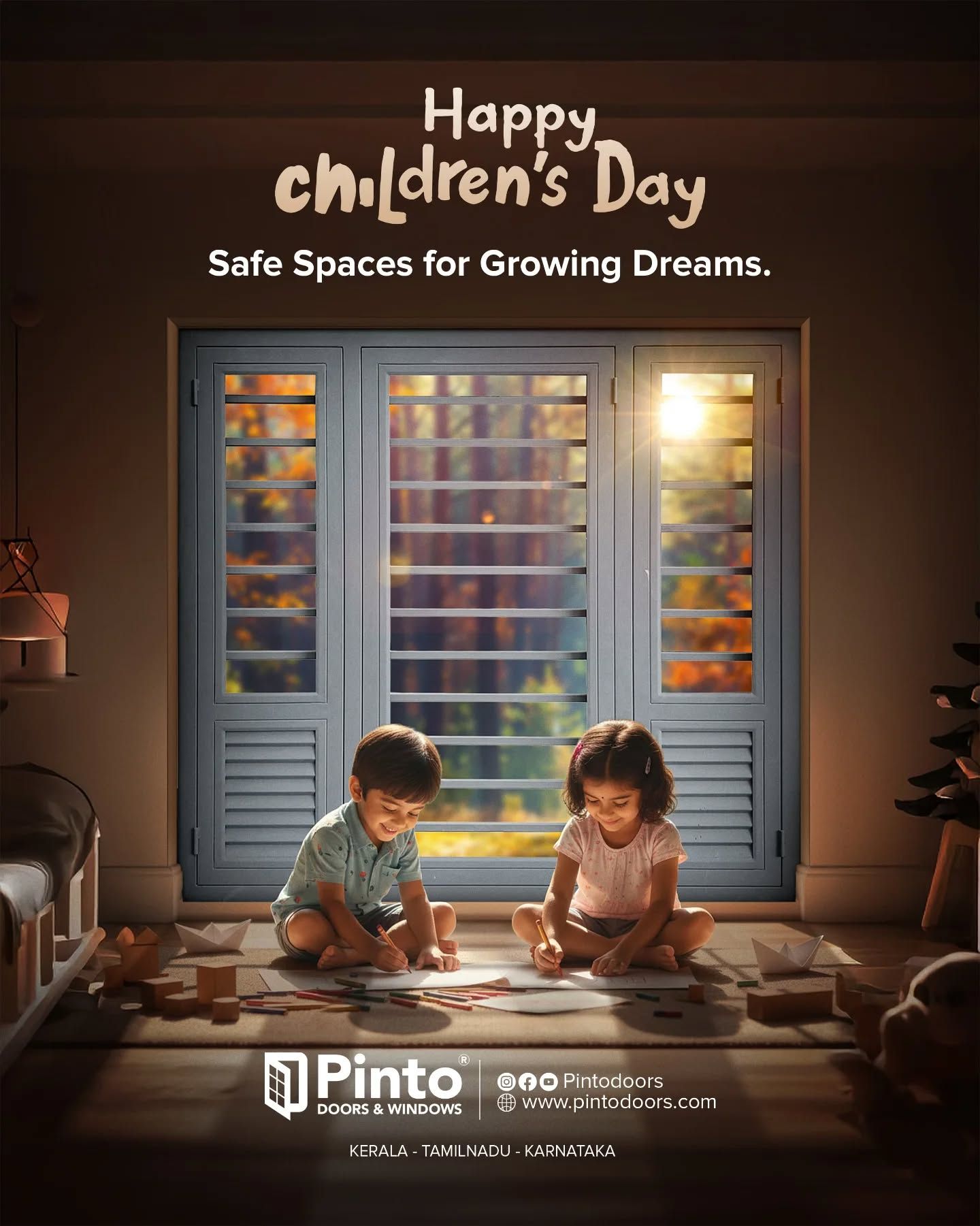 Two children drawing on the floor in front of a grey steel window