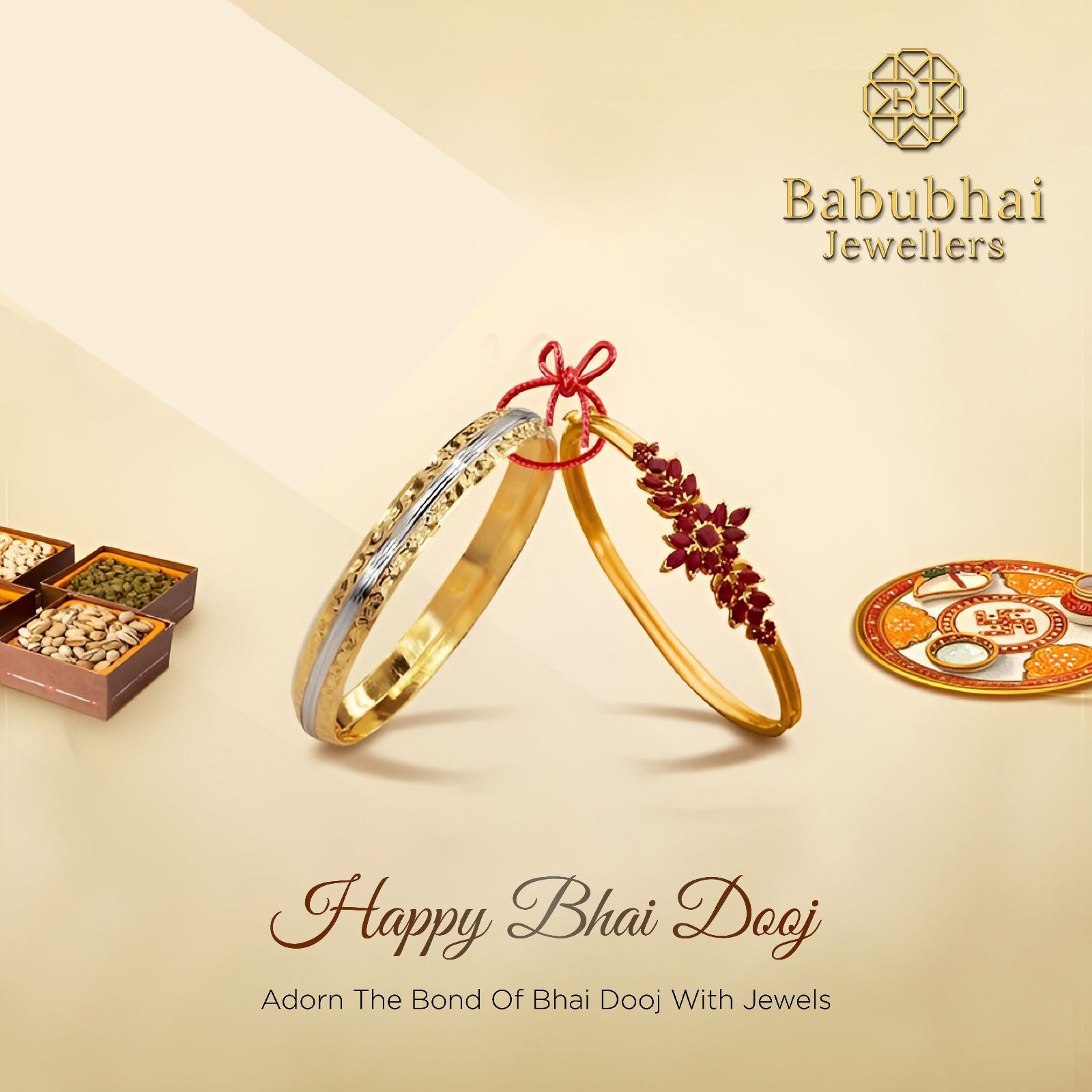 Two gold bangles leaning together, tied with red thread