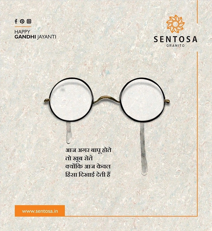 Gandhi Jayanti creative ad: Gandhi's round spectacles on a granite surface with tears dripping from the lenses