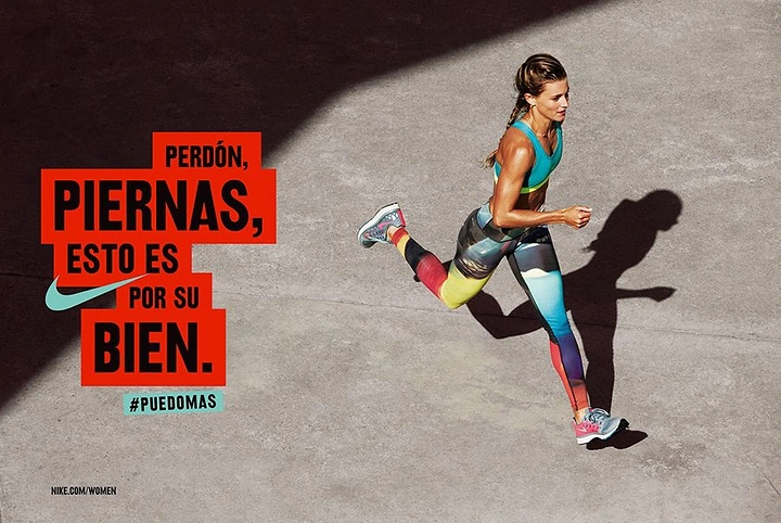 Creative ad: Overhead shot of a woman running on concrete in colourful printed leggings