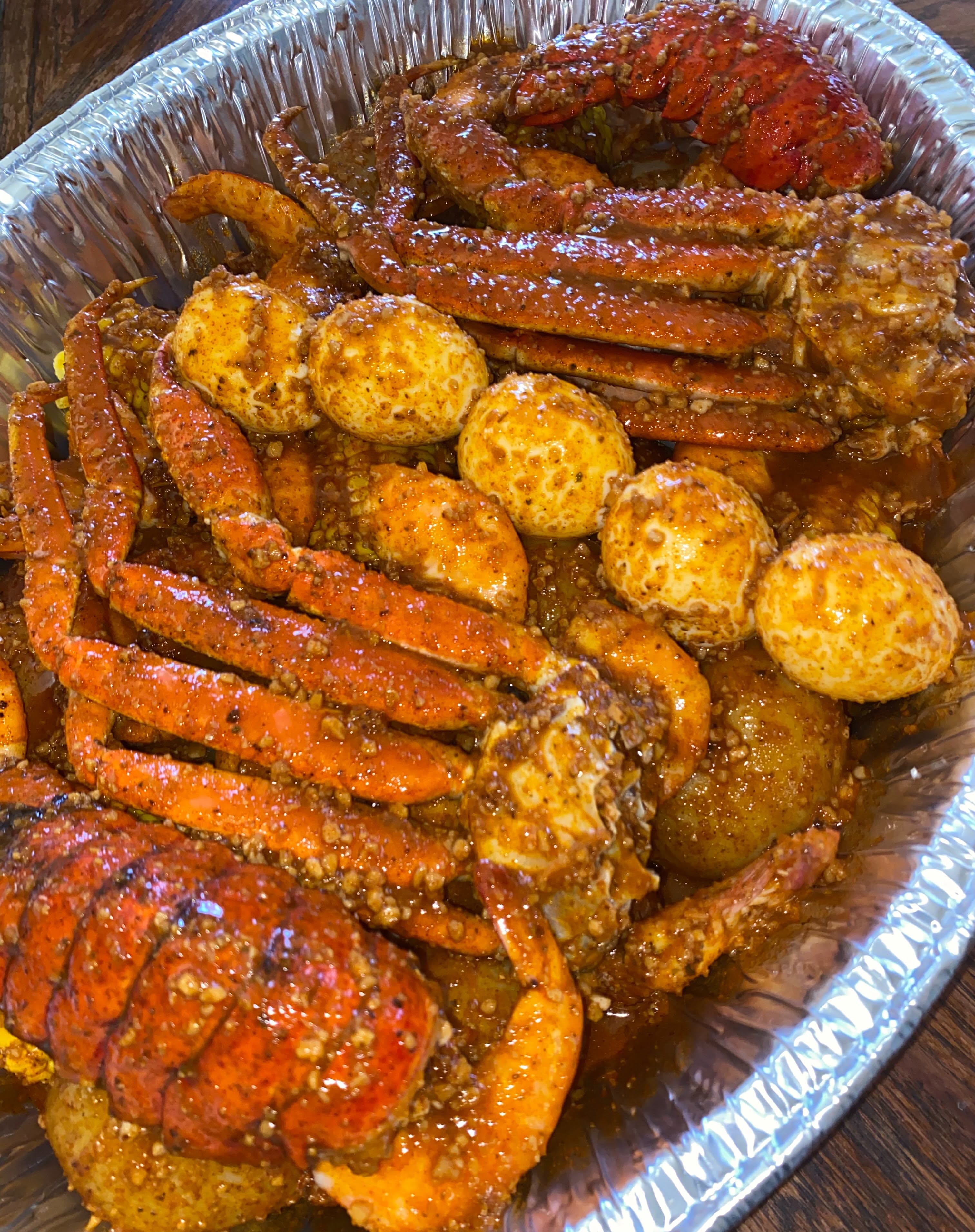 Instagram post: Street poster dramatizes overflowing seafood boil, slide 3