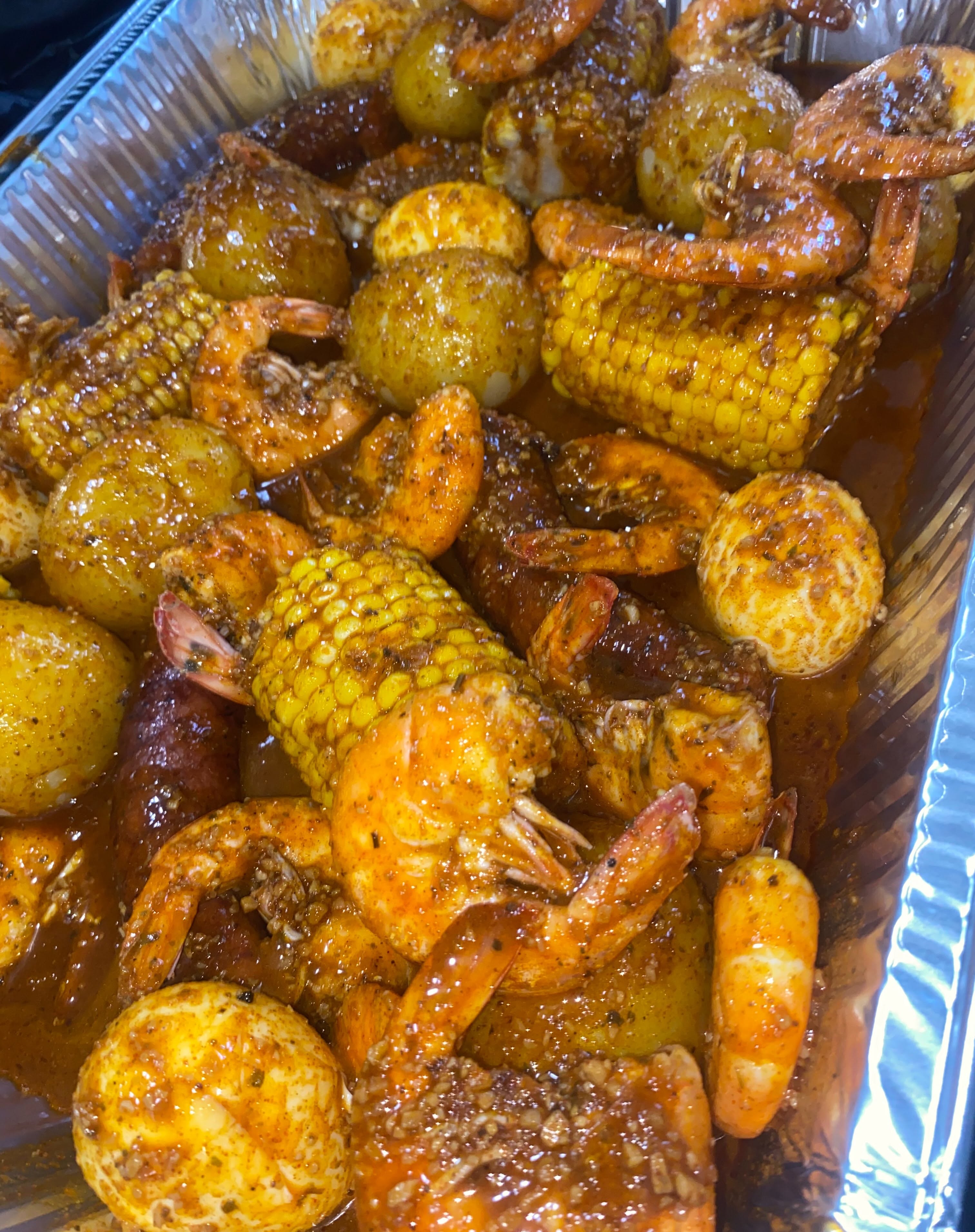 Instagram post: Street poster dramatizes overflowing seafood boil, slide 4