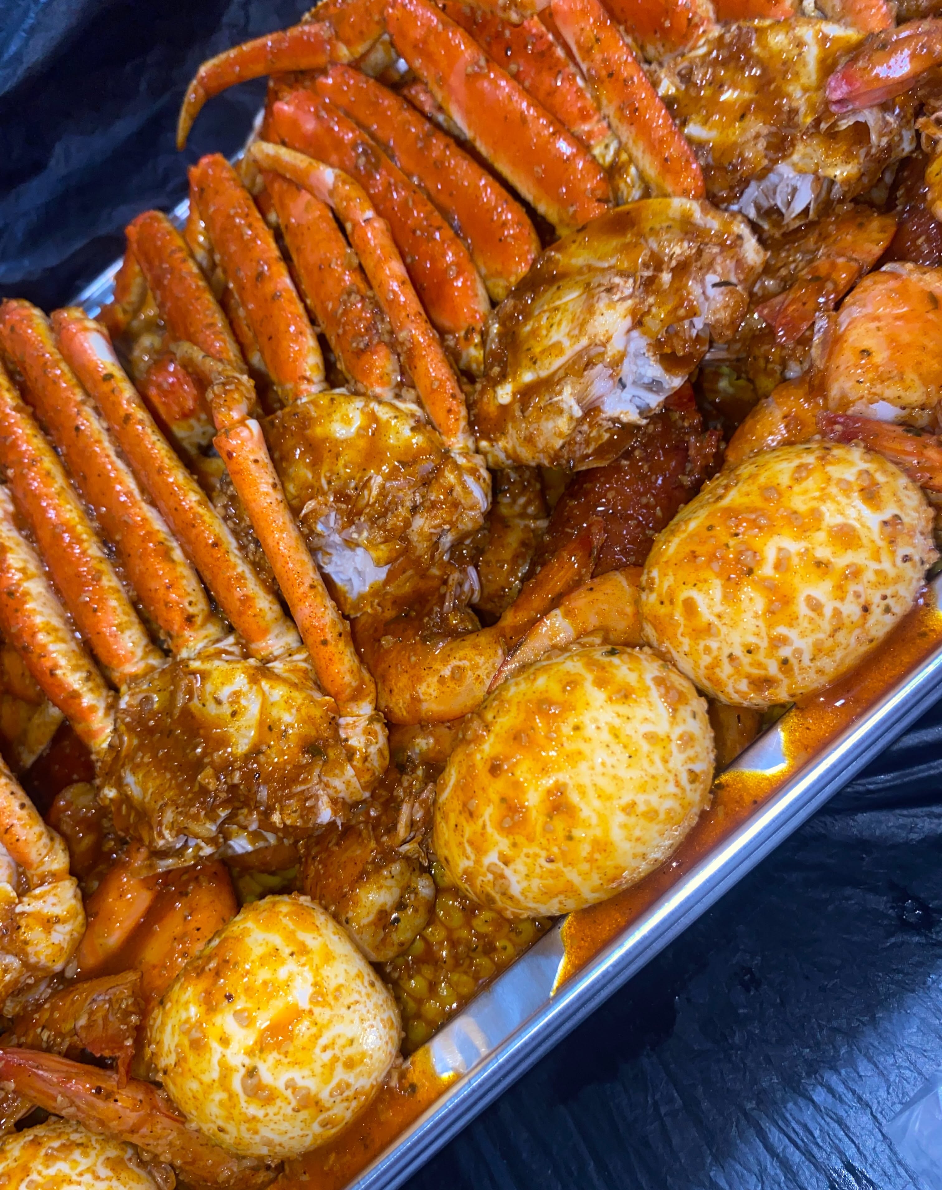 Instagram post: Street poster dramatizes overflowing seafood boil, slide 5