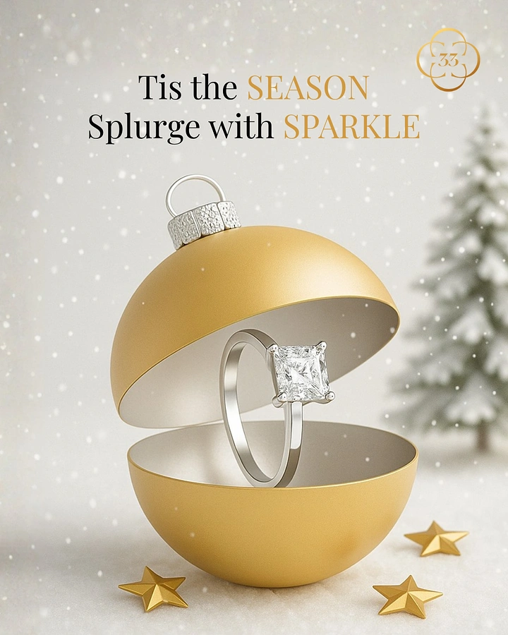 Christmas creative ad: Solitaire diamond ring inside an opened gold Christmas bauble