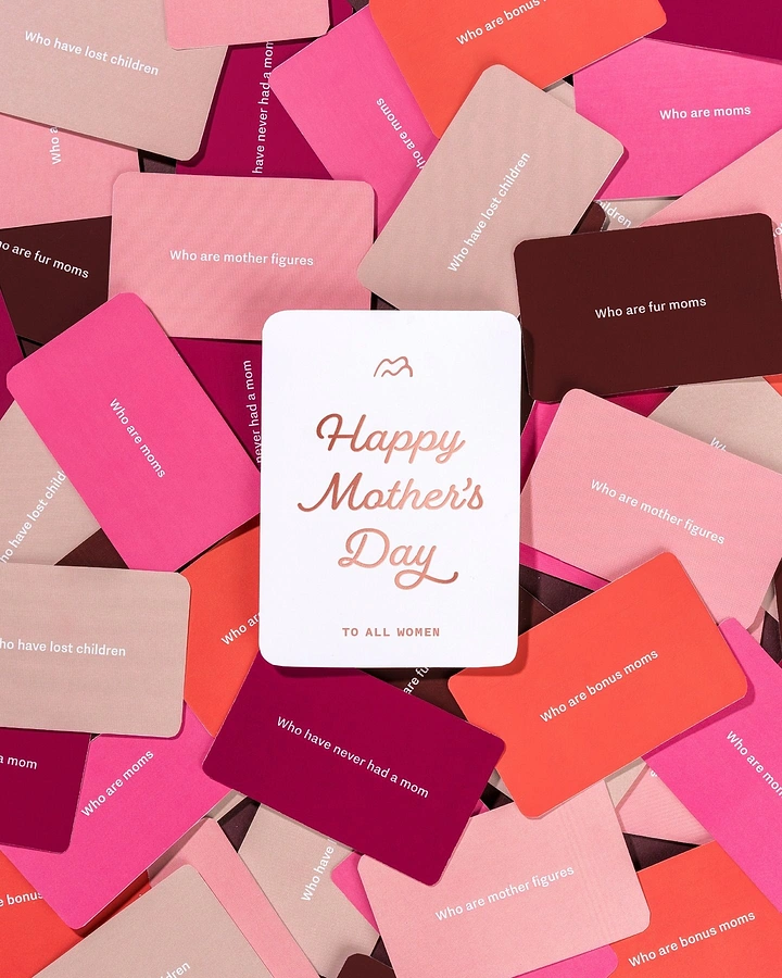Mother's Day creative ad: White foil-printed card on a pile of colorful message cards