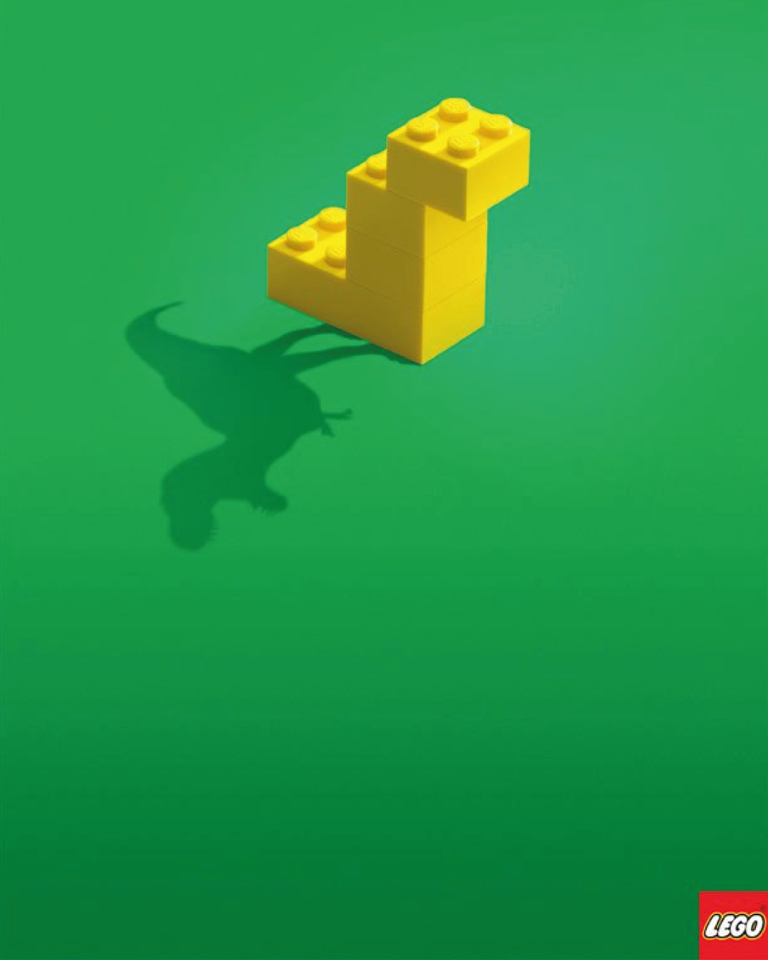 Instagram post: Simple yellow brick stack casting a T-rex shadow