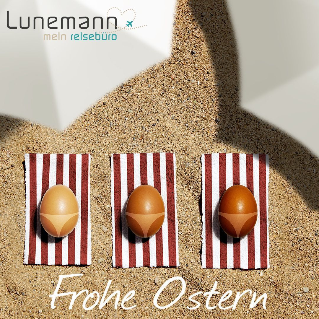 Three brown eggs sunbathing on striped towels with bikini tan lines
