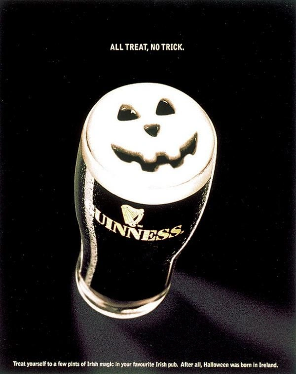Halloween creative ad: Pint of stout with a jack-o'-lantern face carved in the foam