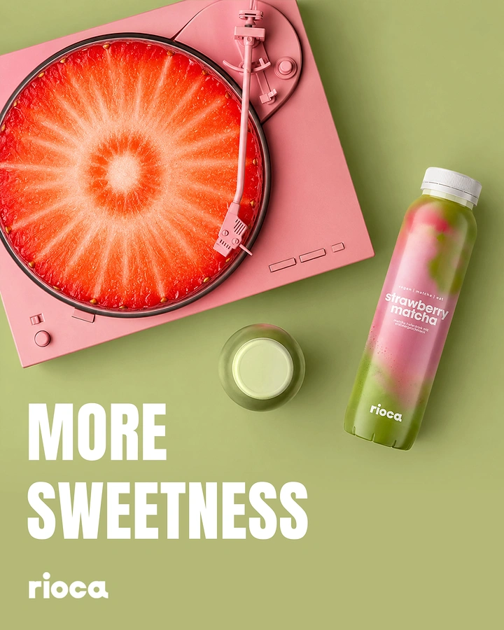 Creative ad: Strawberry cross-section as a record on a pink turntable beside a strawberry matcha bottle