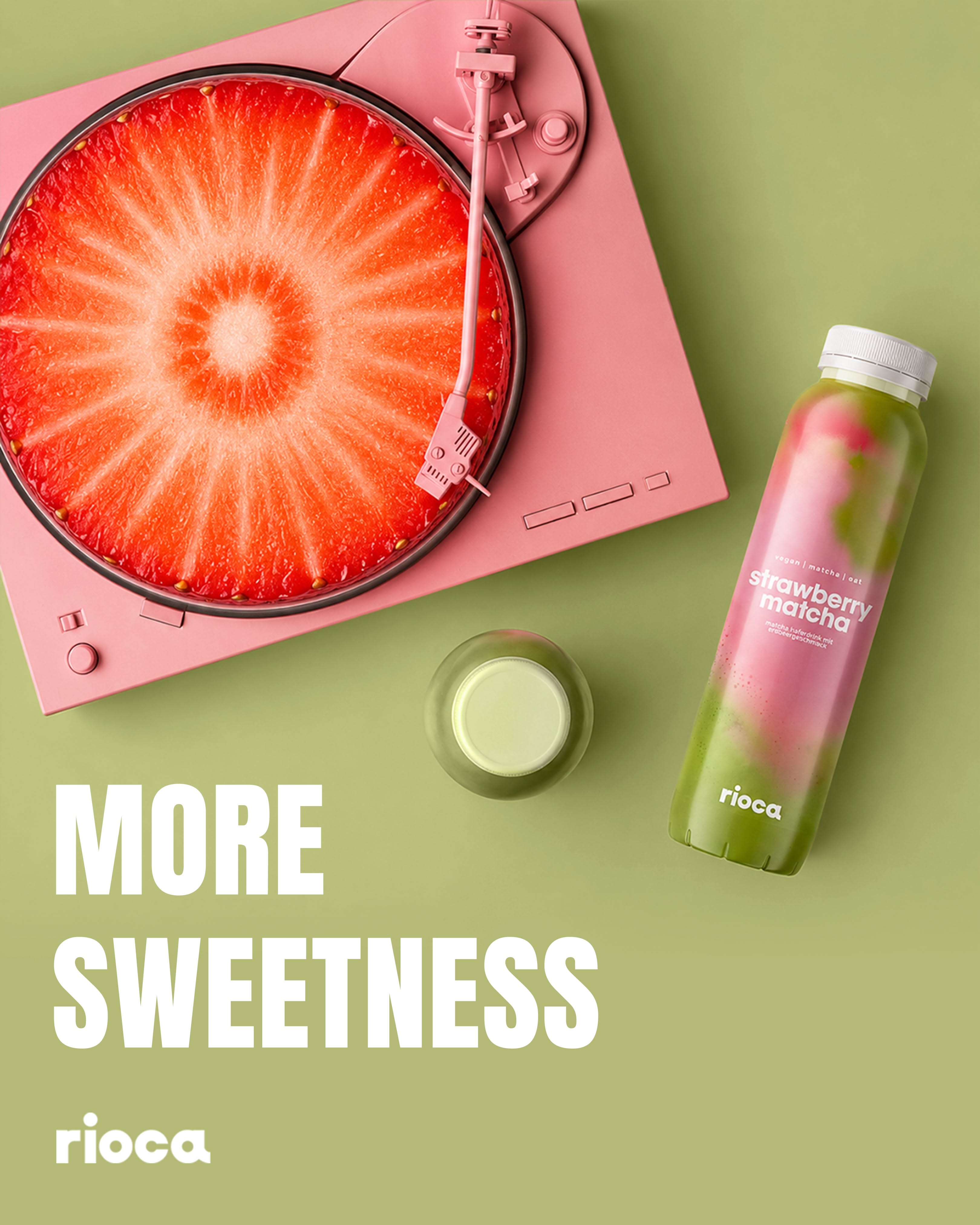 Carousel: Strawberry cross-section as a record on a pink turntable beside a strawberry matcha bottle, slide 1