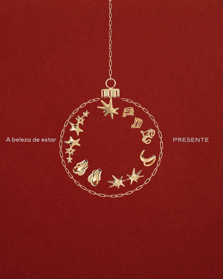 Christmas creative ad: Christmas bauble outline made of gold chain and charms