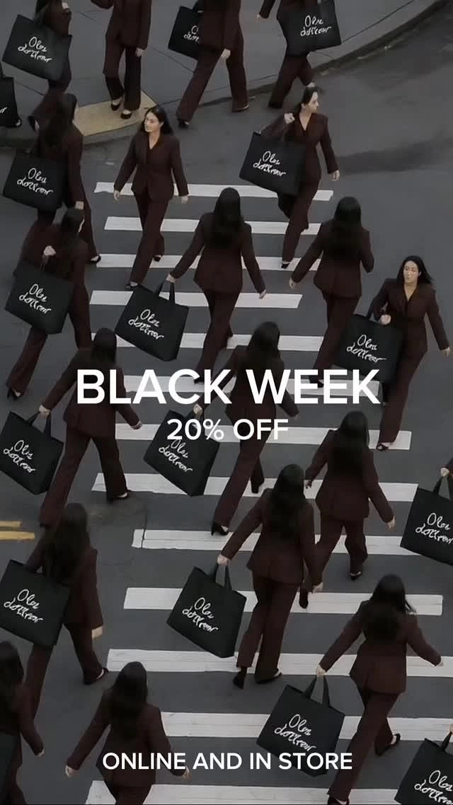 Black Friday creative ad: Cloned women in burgundy suits carrying branded bags across a crosswalk