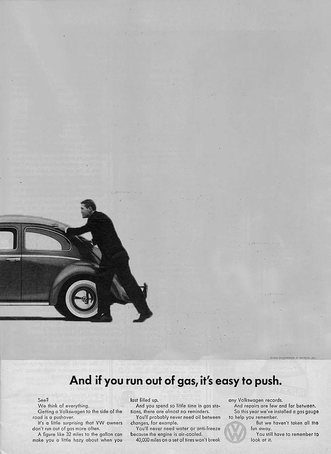 Automotive creative ad: Man pushing a compact car off frame