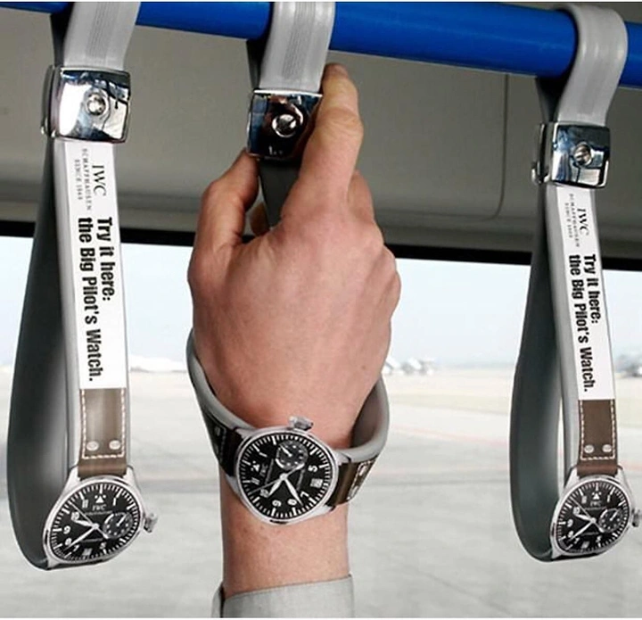 Watches & Accessories creative ad: Bus hand straps shaped like pilot watches, one being gripped