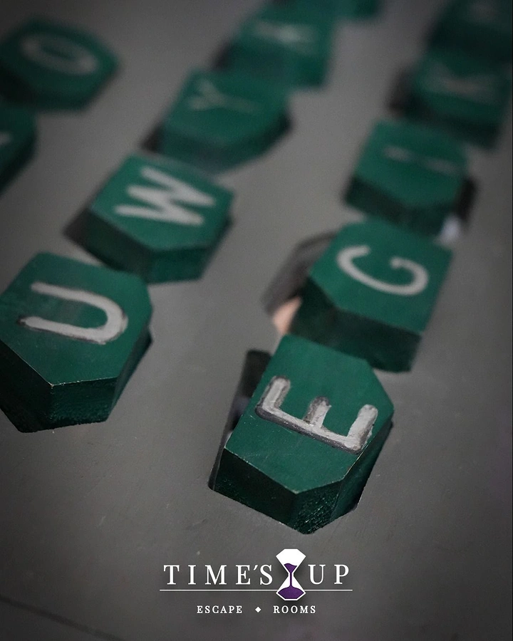 Escape Rooms creative ad: Time's Up message built from game letters