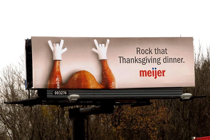 Thanksgiving creative ad: Turkey drumsticks as rock-on hands billboard