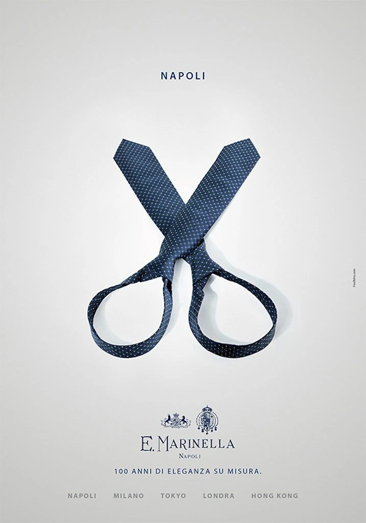 Creative ad: Two navy dotted neckties arranged to form a pair of scissors