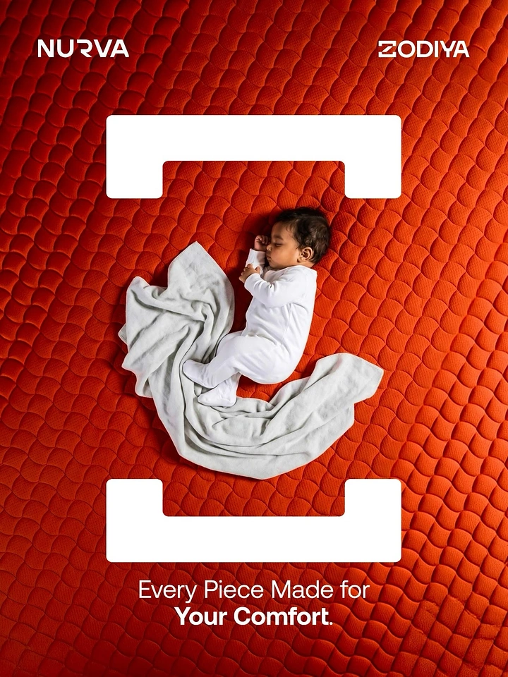 Baby Care Products creative ad: Newborn sleeping on quilted red-orange mattress