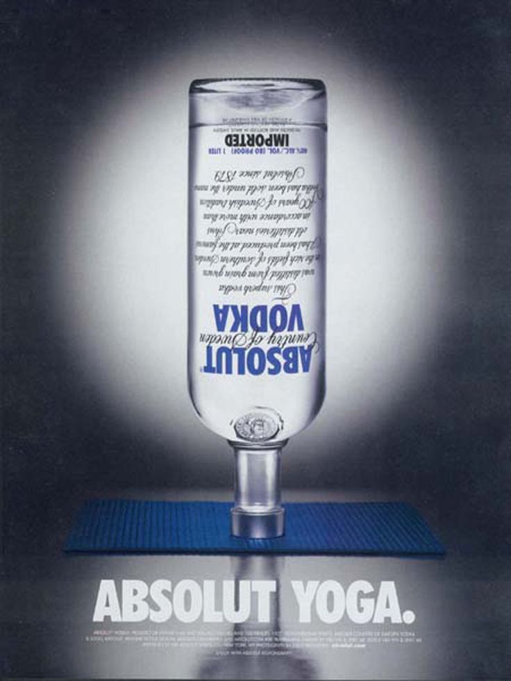 Poster: Vodka bottle balancing upside down on its neck on a blue yoga mat