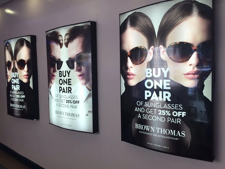 Opticians & Eye Care creative ad: Mirrored twin face for buy-one-pair offer