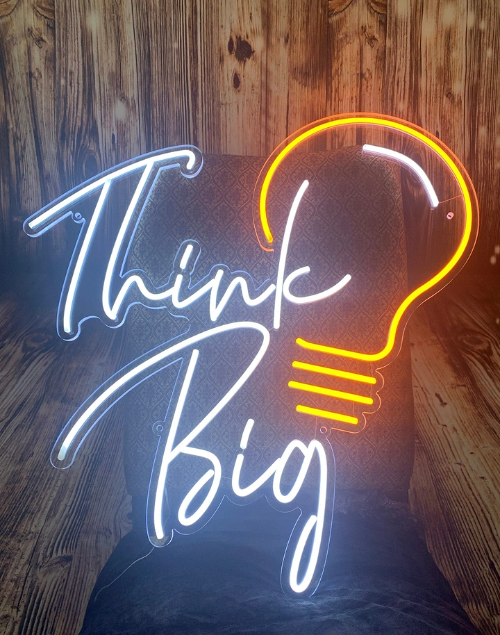 Signage & Sign Makers creative ad: Lightbulb silhouette reinforces Think Big