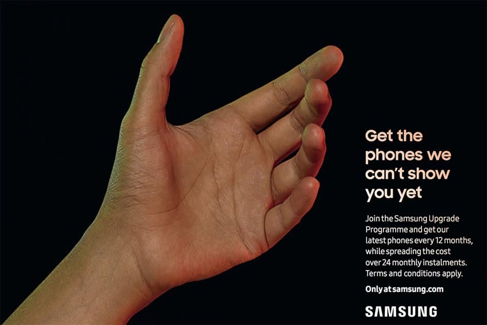 Open hand gripping an invisible phone