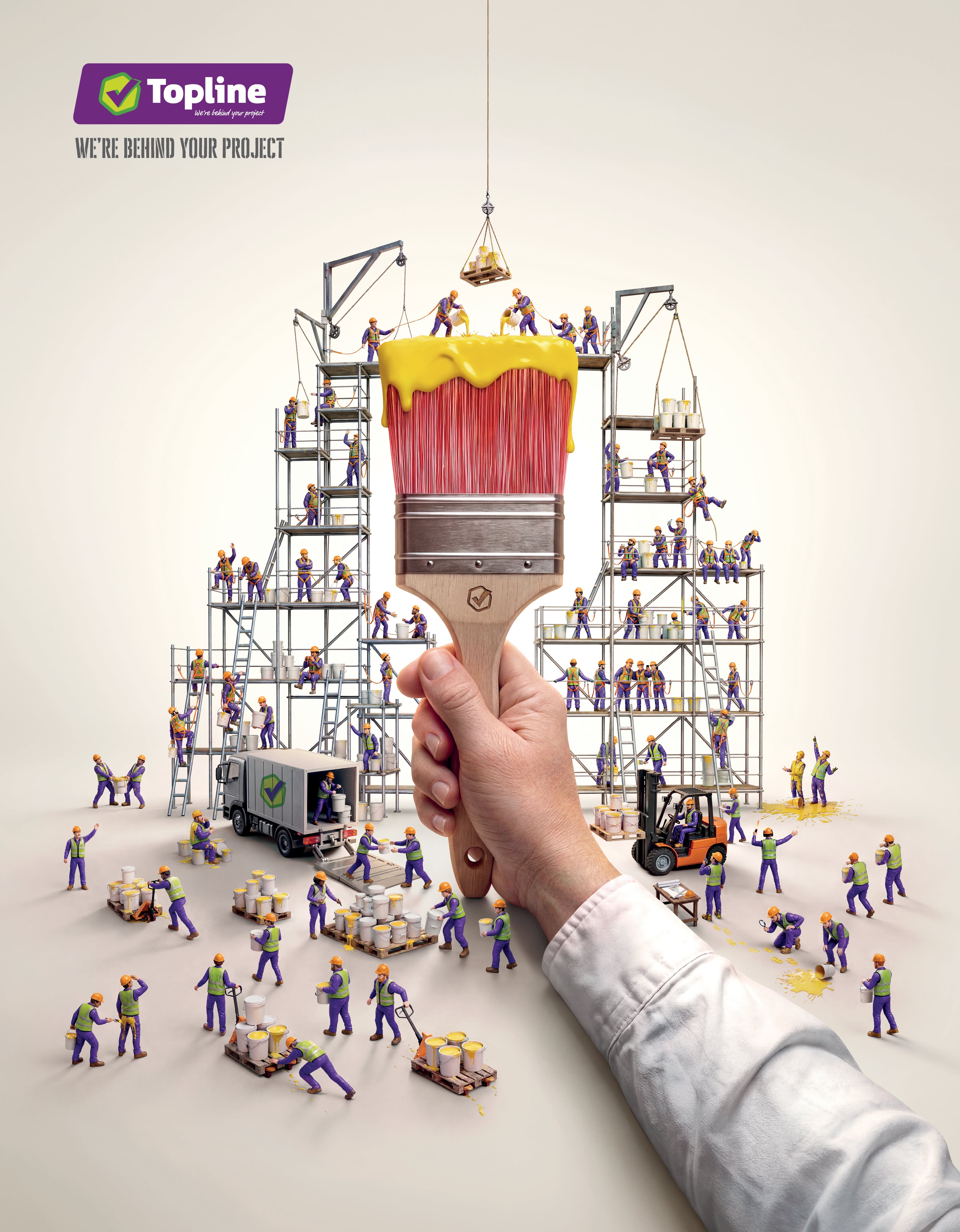 Hand holding a paintbrush surrounded by miniature construction workers on scaffolding