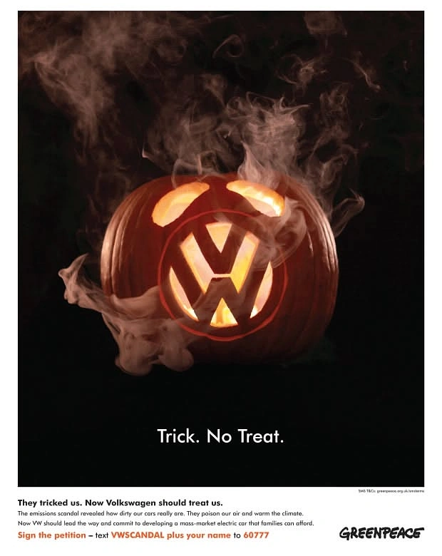 Halloween creative ad: Carved pumpkin with a car logo, wreathed in exhaust smoke