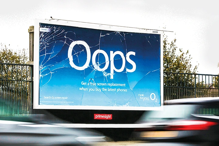 Telecom creative ad: Roadside billboard with a cracked-phone-screen print