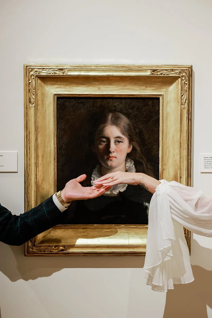 Museums & Art Galleries creative ad: Hands reaching across a framed classical portrait