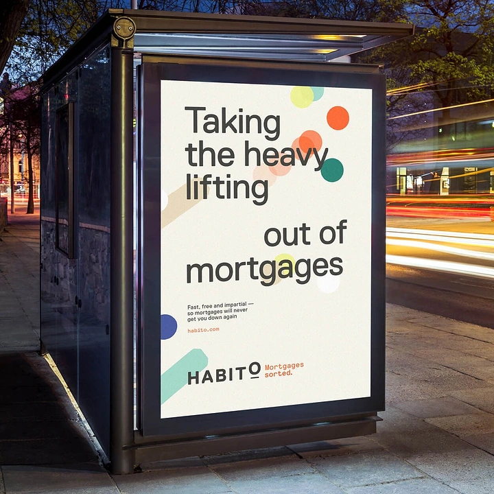 Mortgage & Home Loan Brokers creative ad: Typographic mortgage poster in a bus shelter at dusk