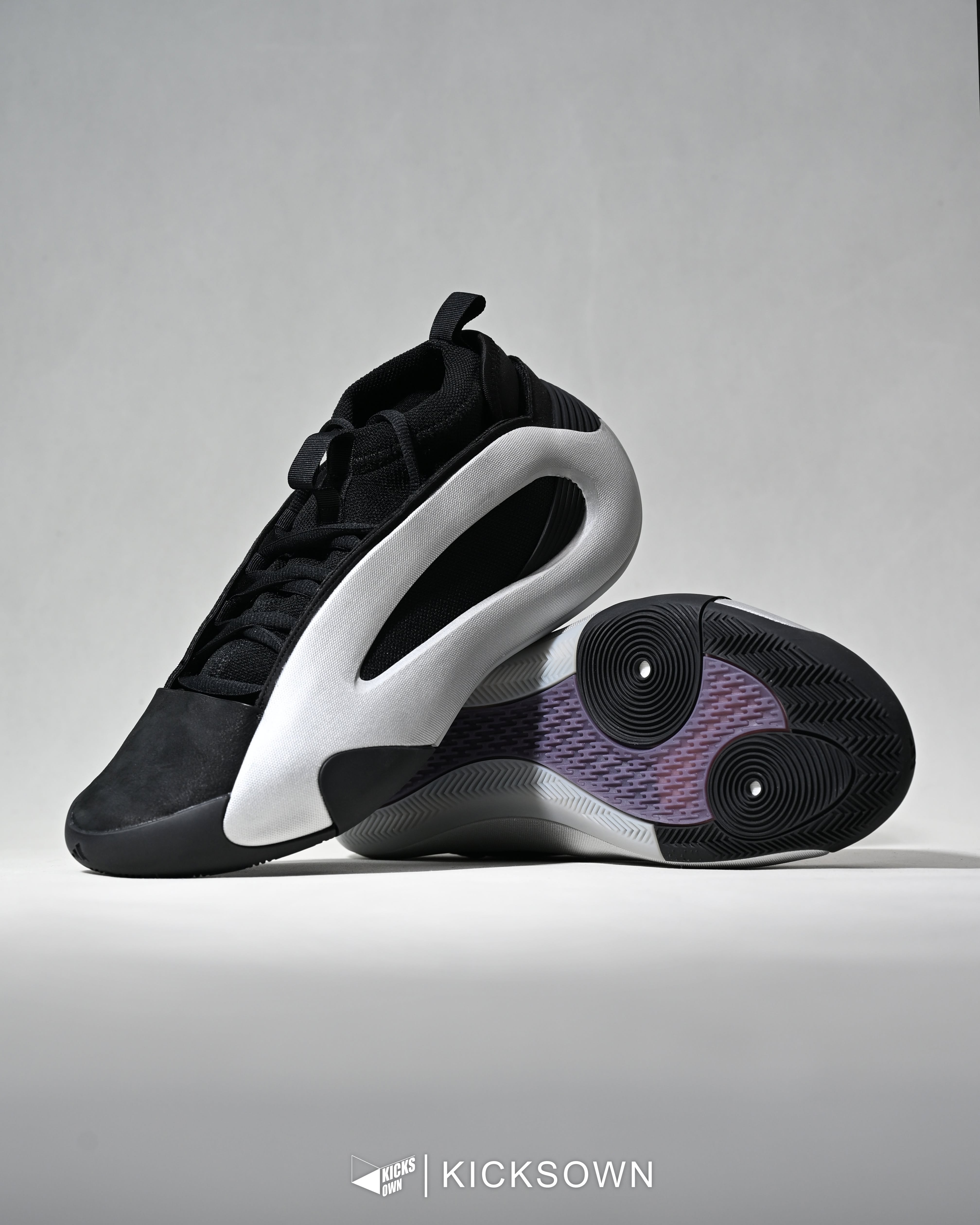 Carousel: Black-and-white sneaker being abducted by a UFO over a farm, slide 2