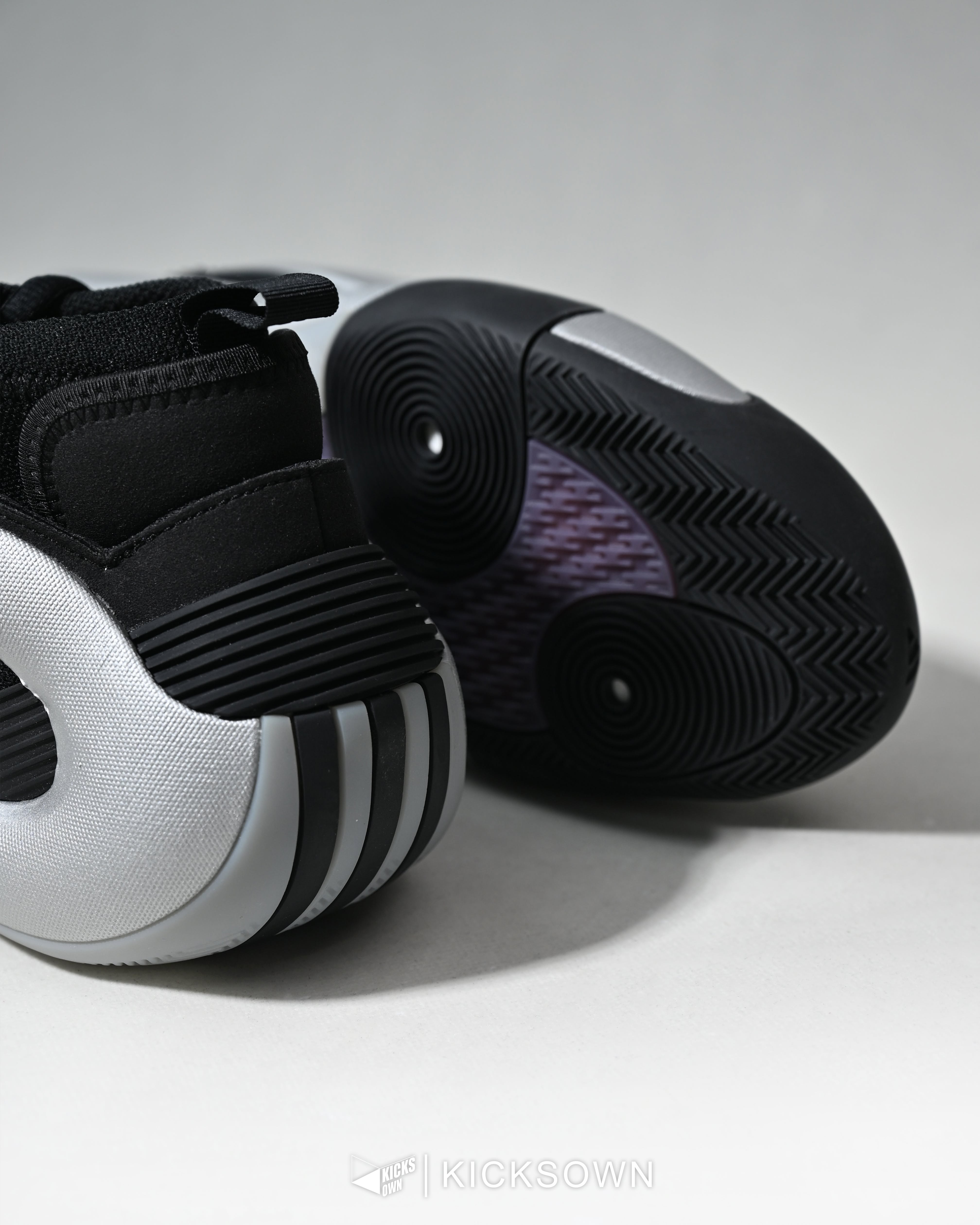Carousel: Black-and-white sneaker being abducted by a UFO over a farm, slide 3