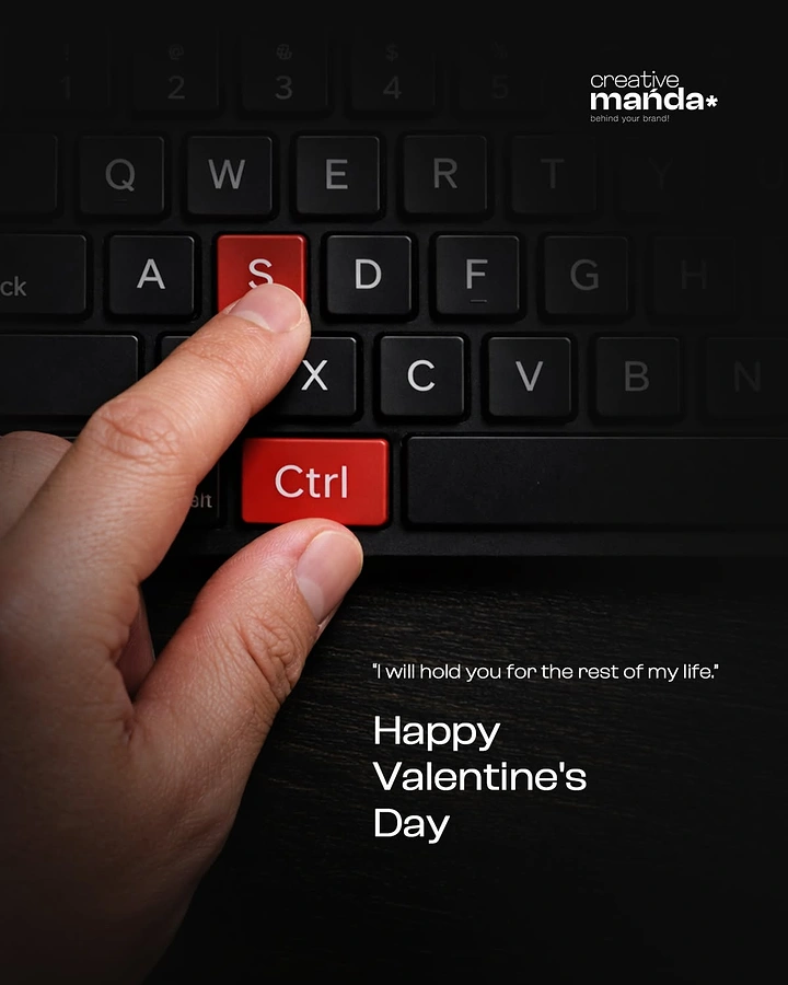 Valentine's Day creative ad: Hand pressing red Ctrl and S keys on a black keyboard