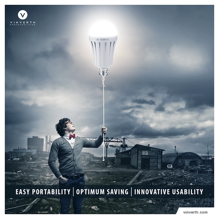 Electricians creative ad: Giant bulb lighting a dark city