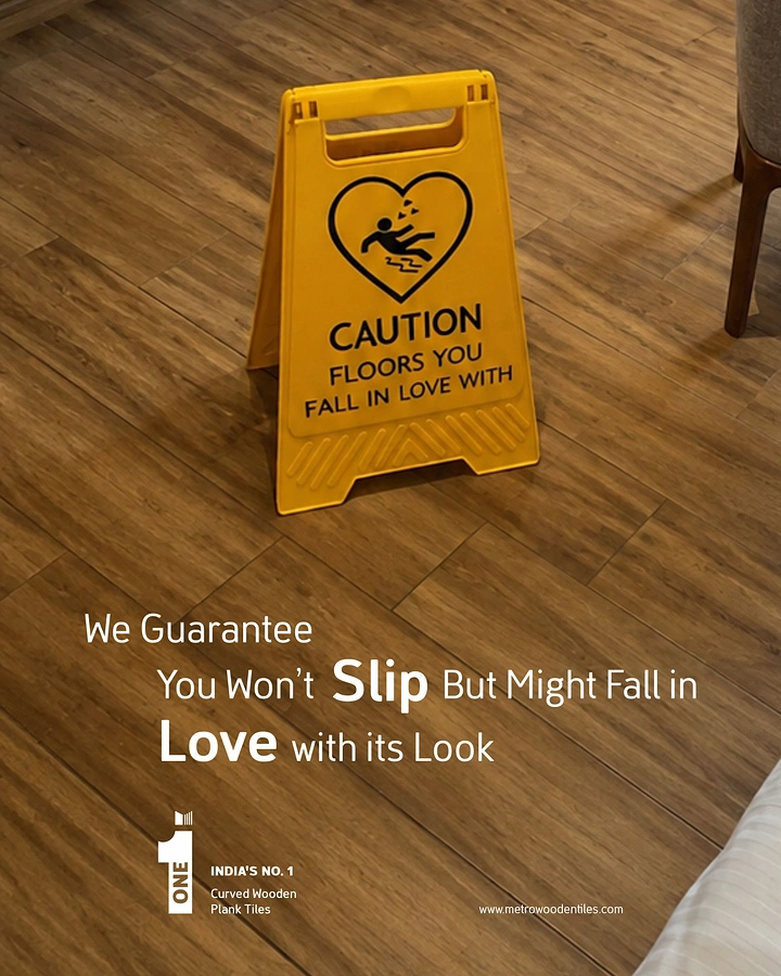 Cement, Steel & Building Materials creative ad: Yellow wet-floor caution sign on wood-look tiles