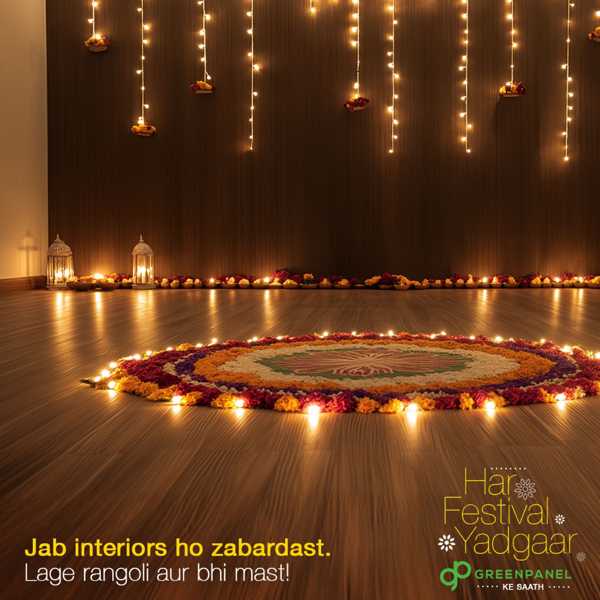 Diwali Instagram post: Flower rangoli ringed with diyas on a wooden floor, with string lights behind