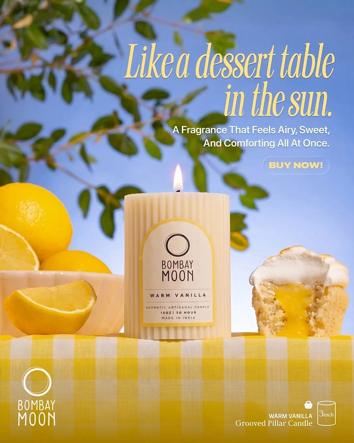 Home Decor creative ad: Ribbed cream pillar candle between lemons and a lemon curd cupcake