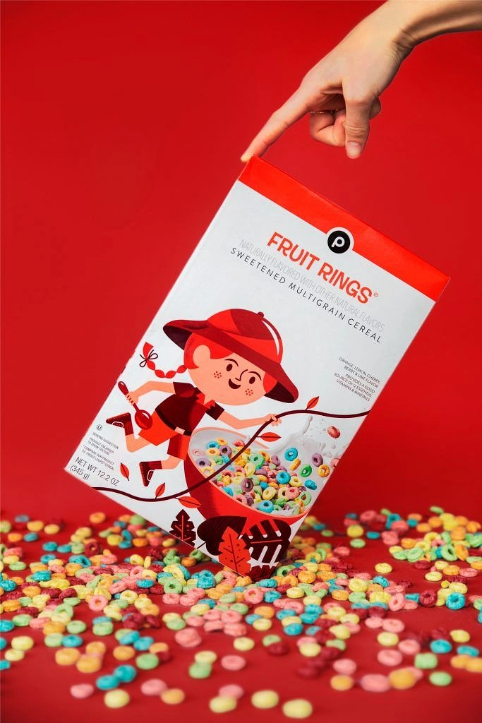 Breakfast Cereals & Oats creative ad: Handheld box and cereal spill composition