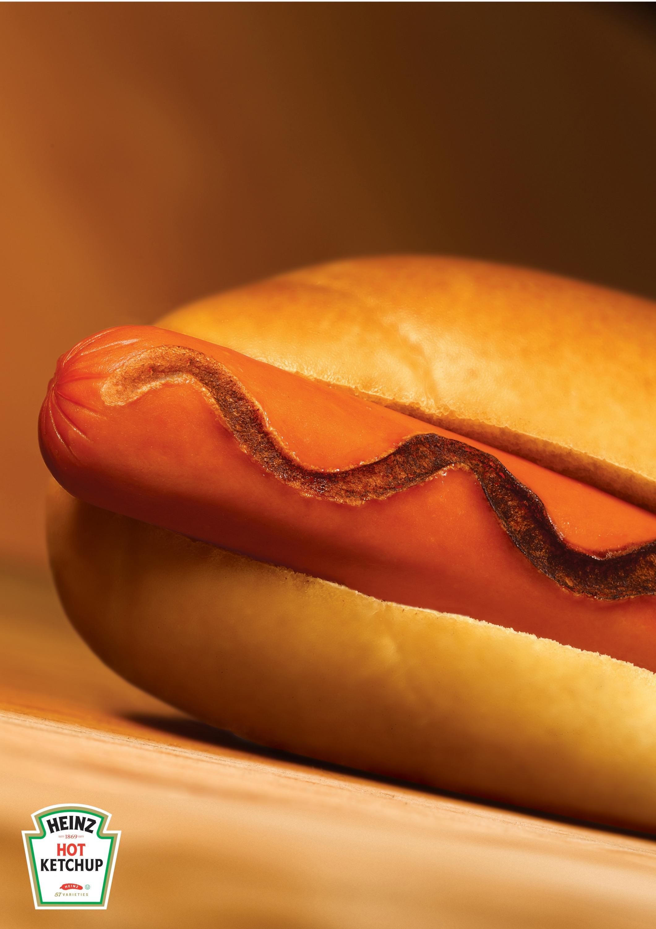 Poster: Hot dog with a charred, burnt-looking ketchup squiggle
