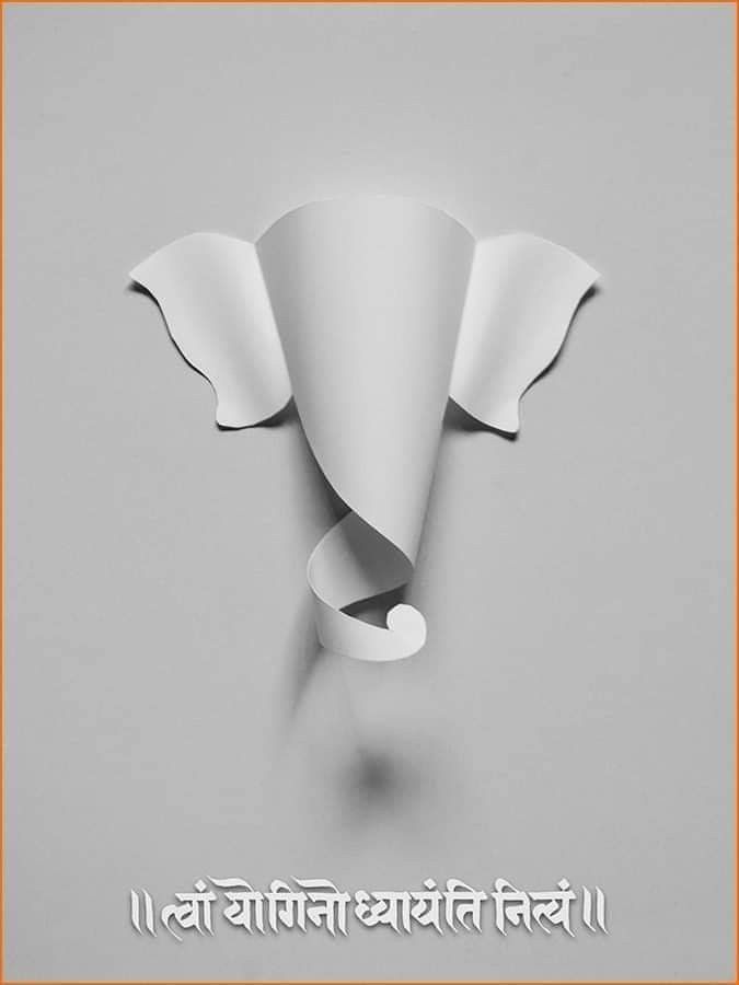Ganesha face made from curled white paper