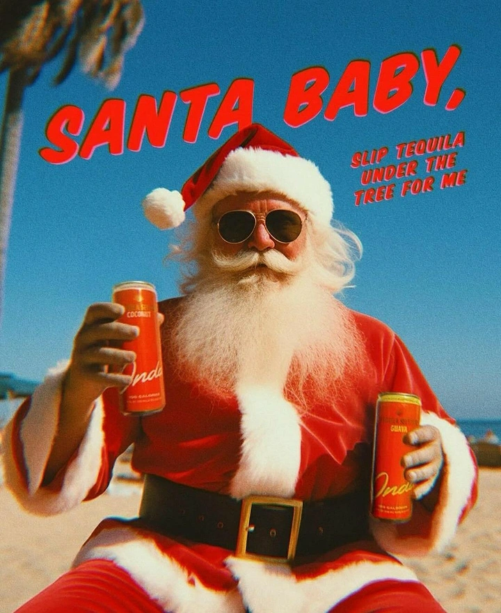 Christmas creative ad: Santa in aviators on a beach holding two canned tequila drinks