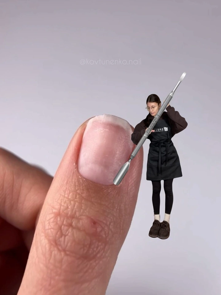 Nail Salons creative ad: Tiny nail tech wielding giant cuticle pusher