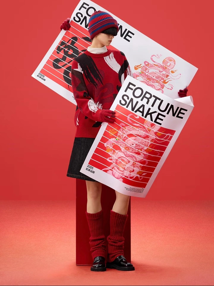Lunar New Year creative ad: Model in a red knit sweater holding two Year of the Snake posters